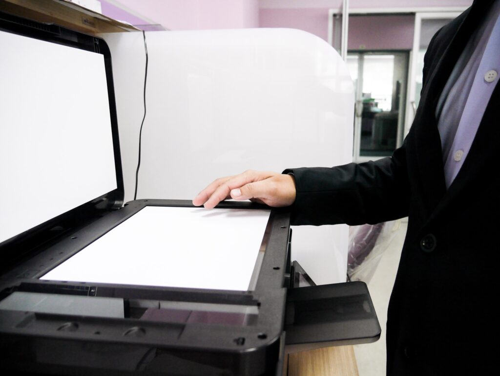 Officer copying document with copier machine